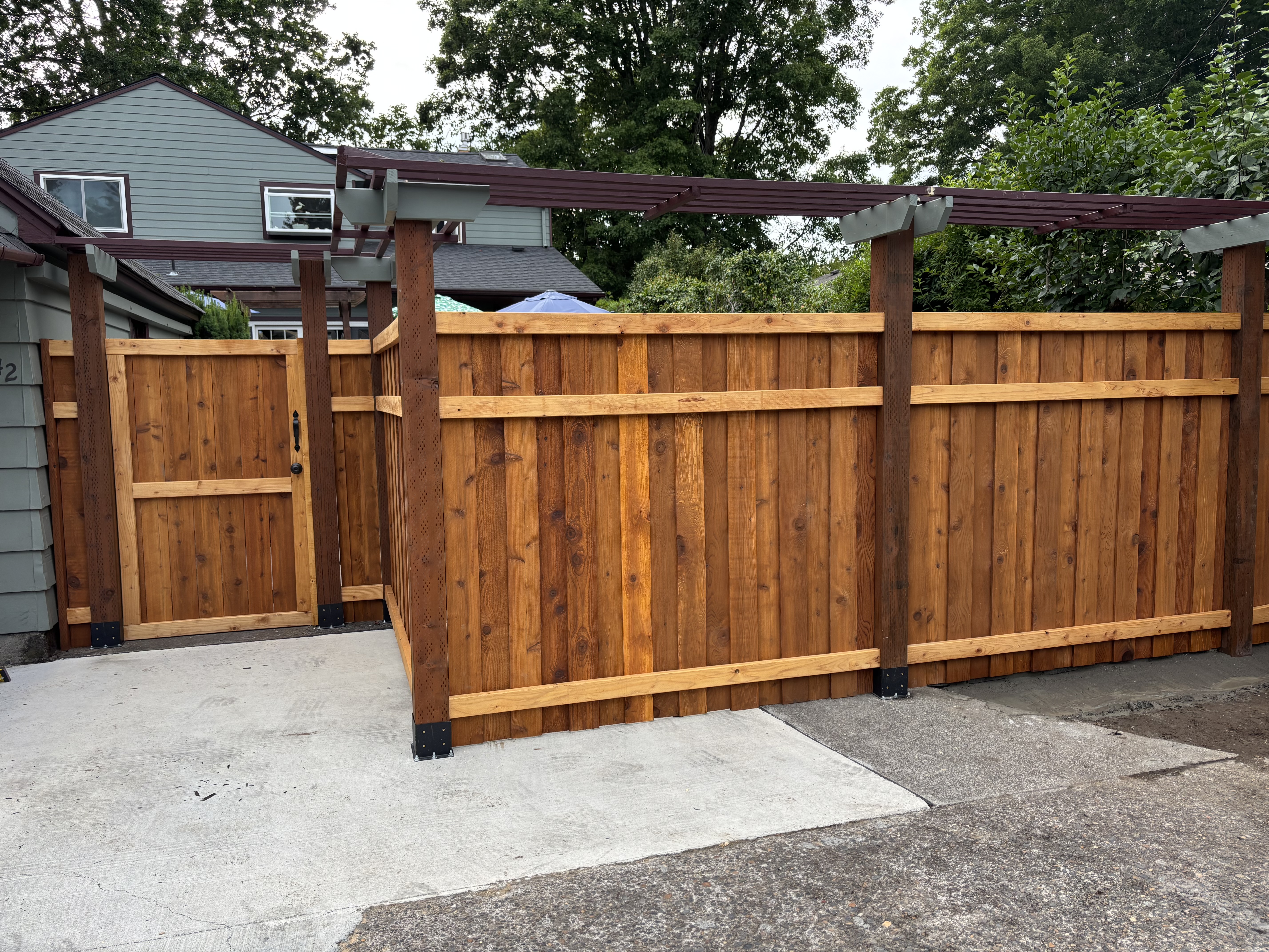 Custom cedar fence installation in Cowlitz County backyard