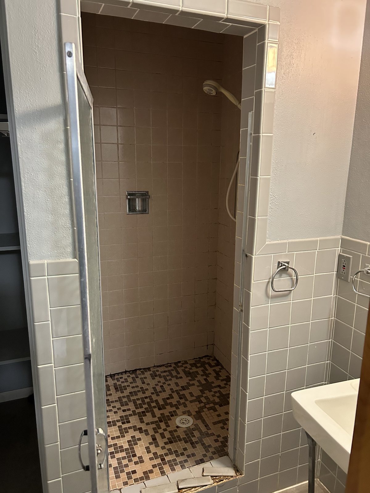 Original dated tile shower before the remodel